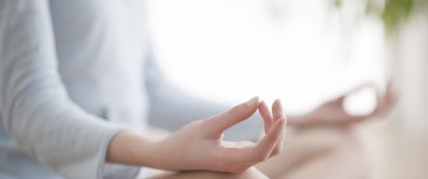 woman meditating to help beat cravings