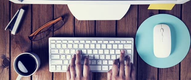 person typing on computer